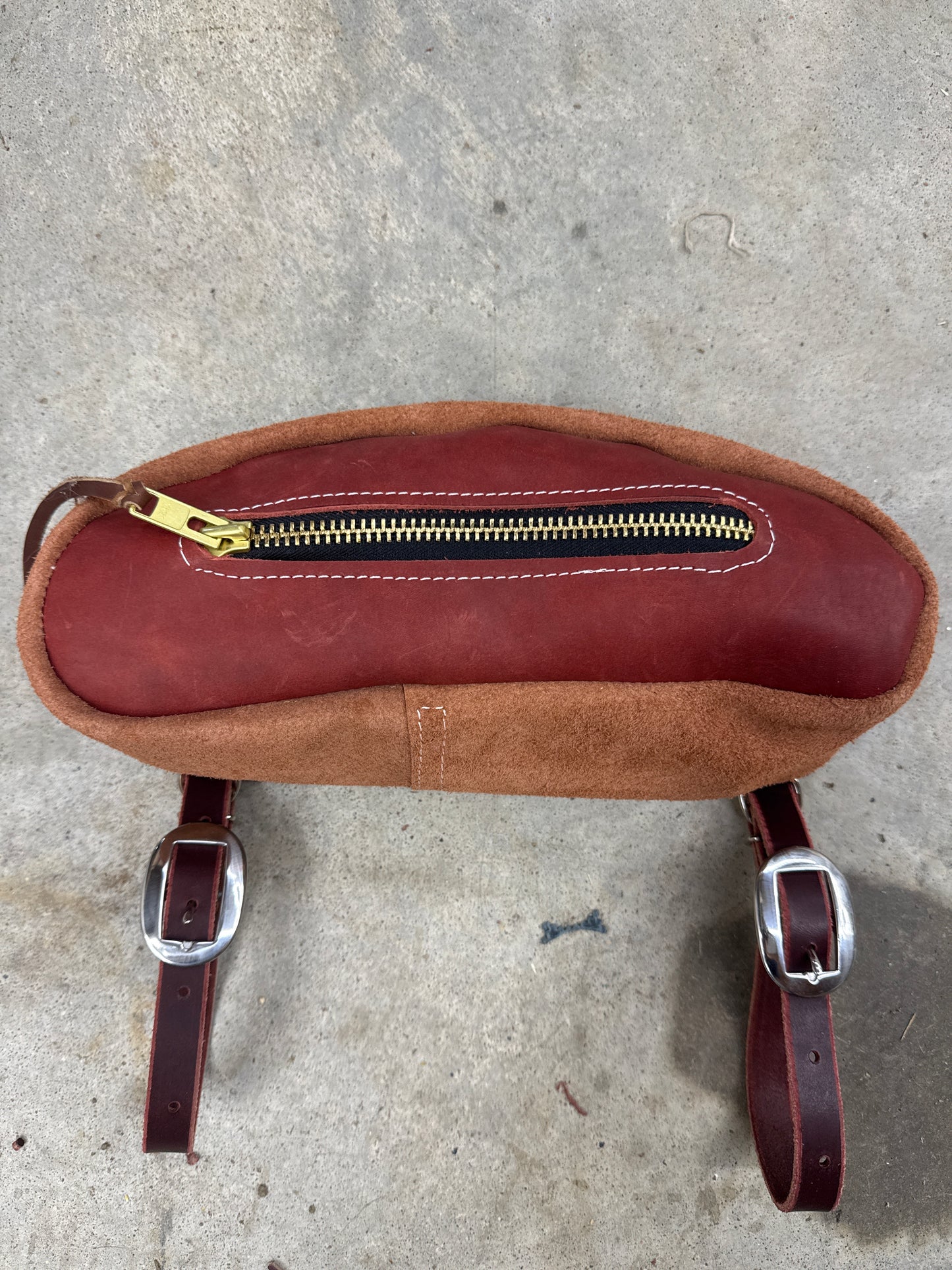 Red smooth out small cantle bag.