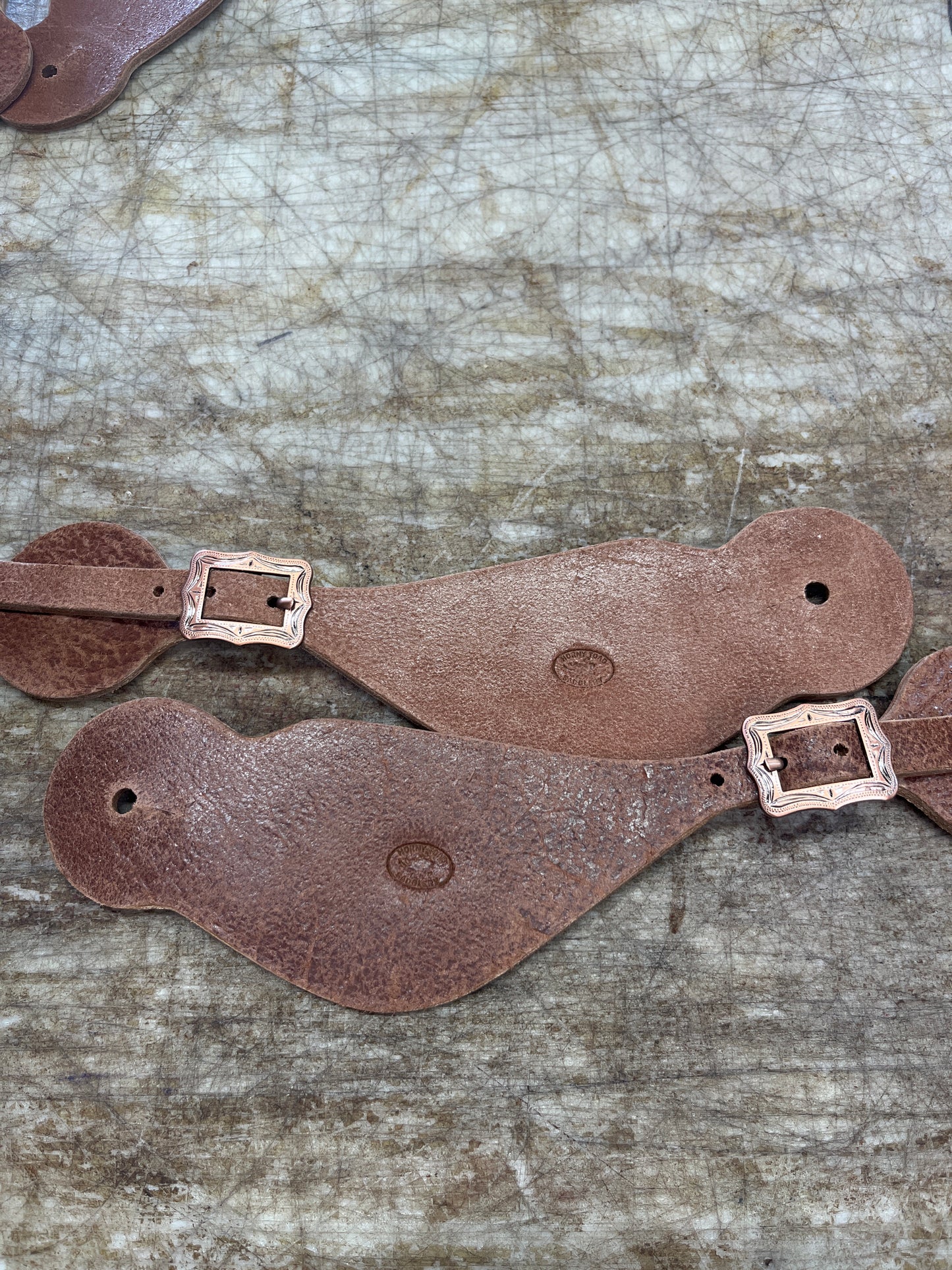Large spur straps with copper buckles