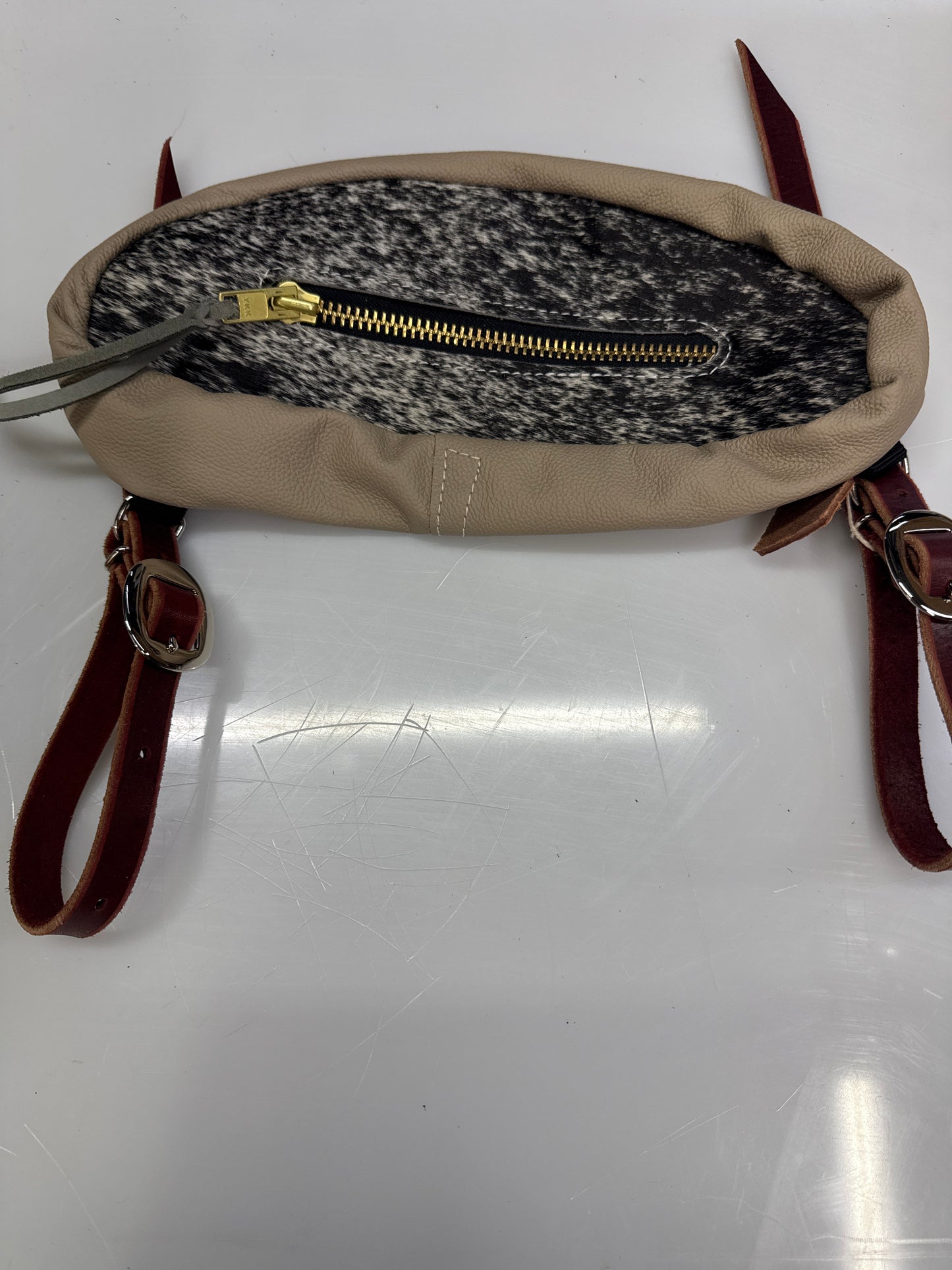 Black and white hair on small bag