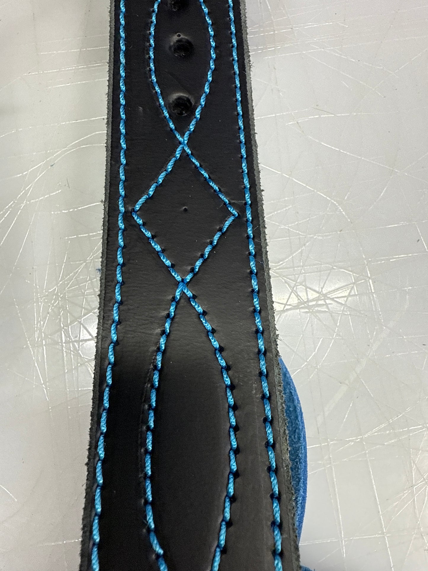 Black Ace with blue stitching