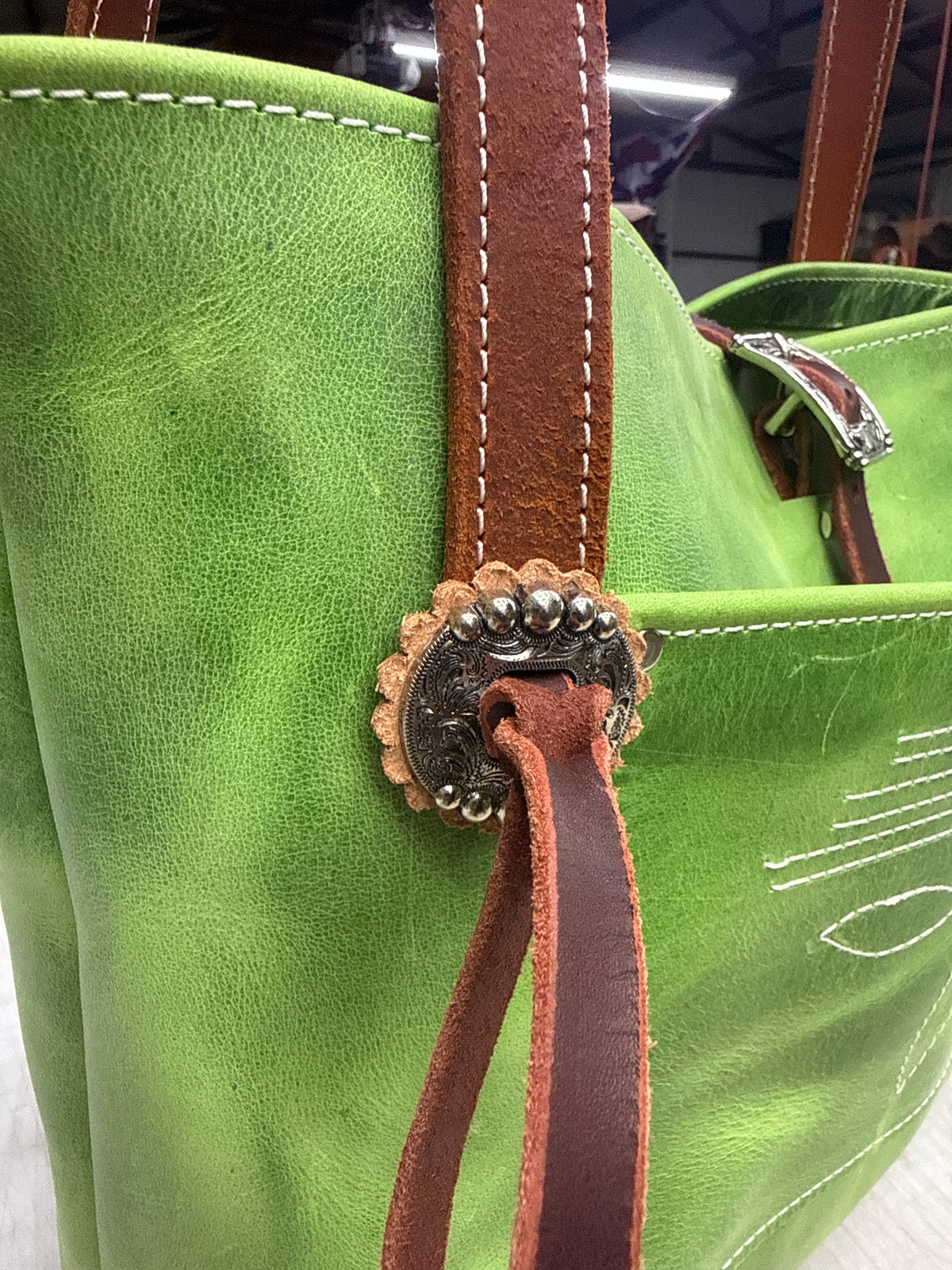 Green tote with fancy hardware
