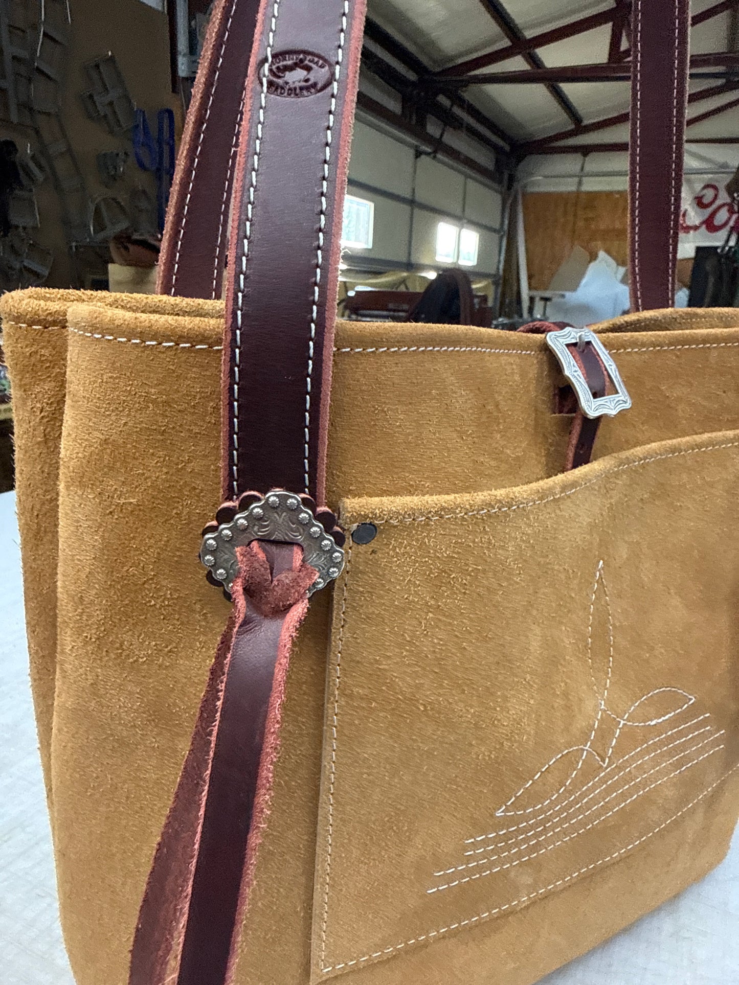 Tan ruff out tote with fancy hardware