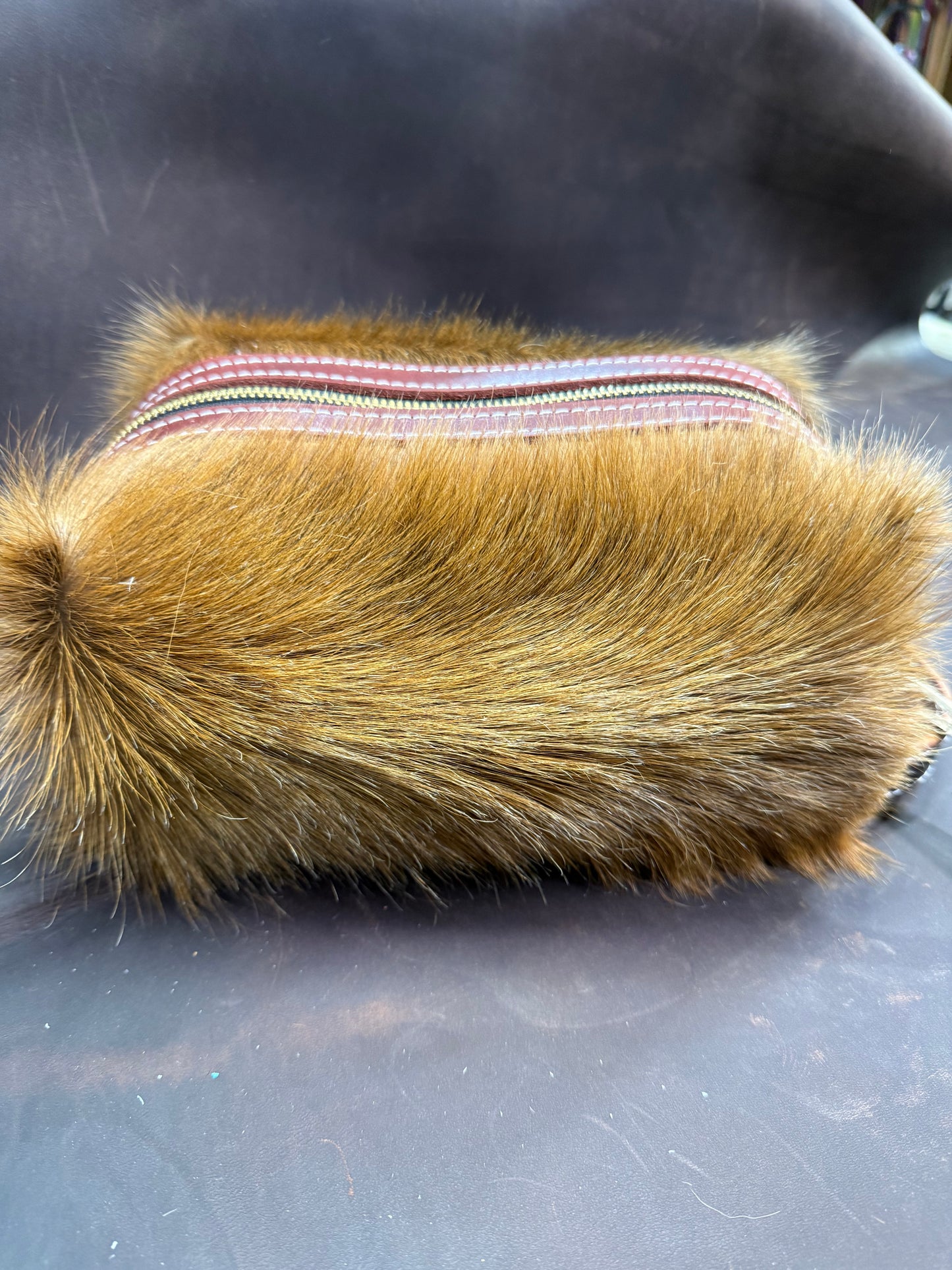 Brown hair on hide bag