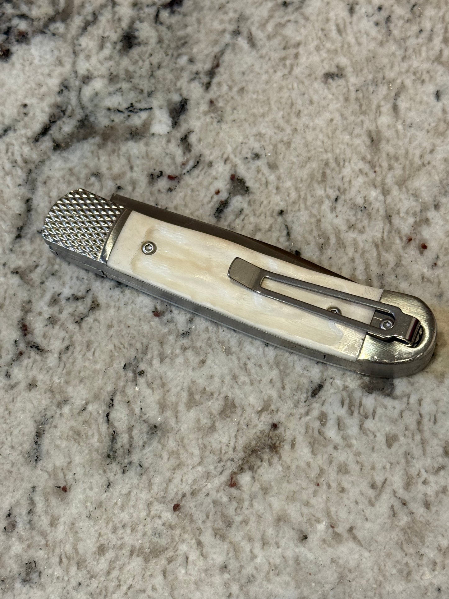 White Spring loaded Knife