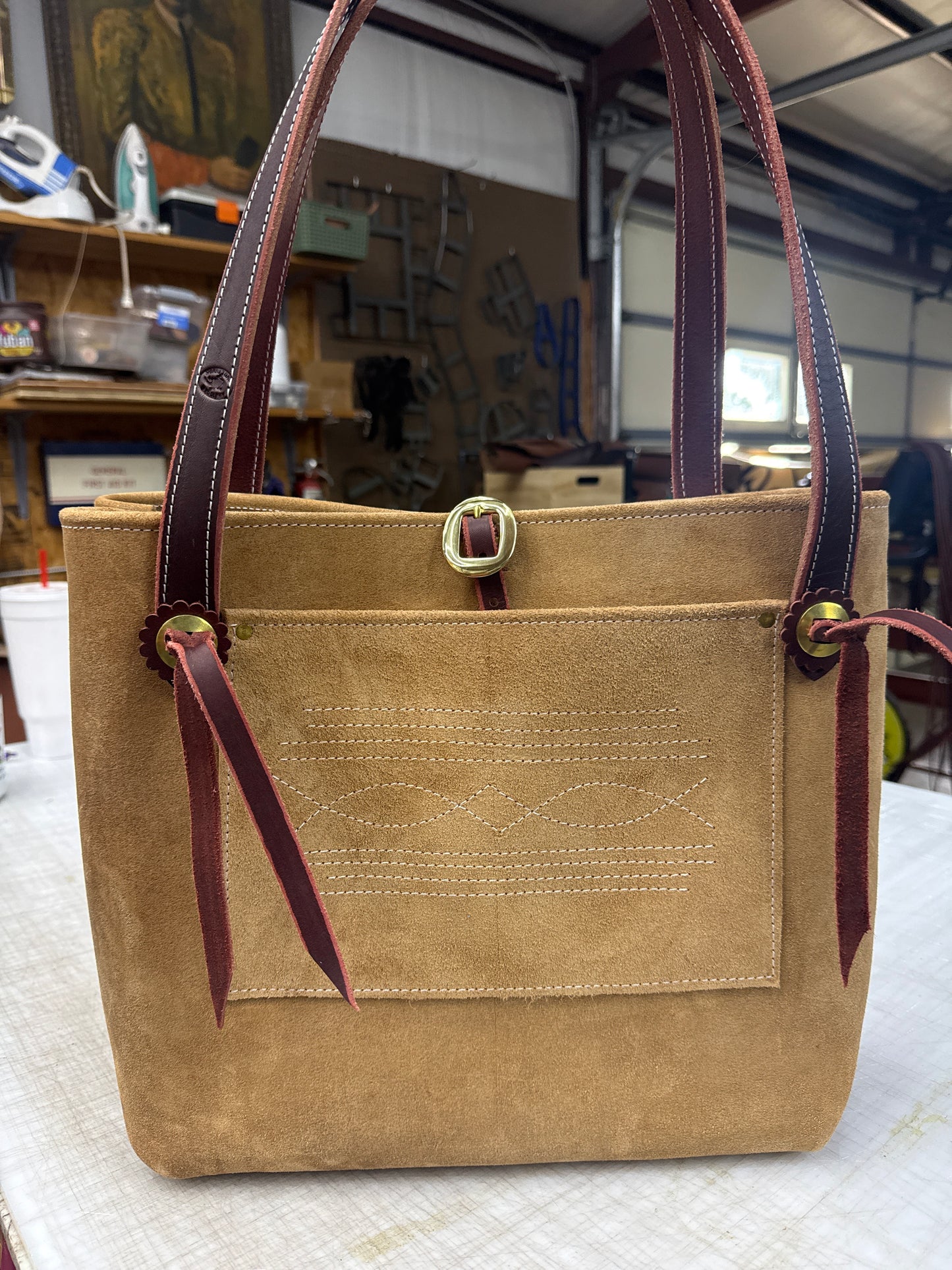 Tan ruff out tote with brass hardware
