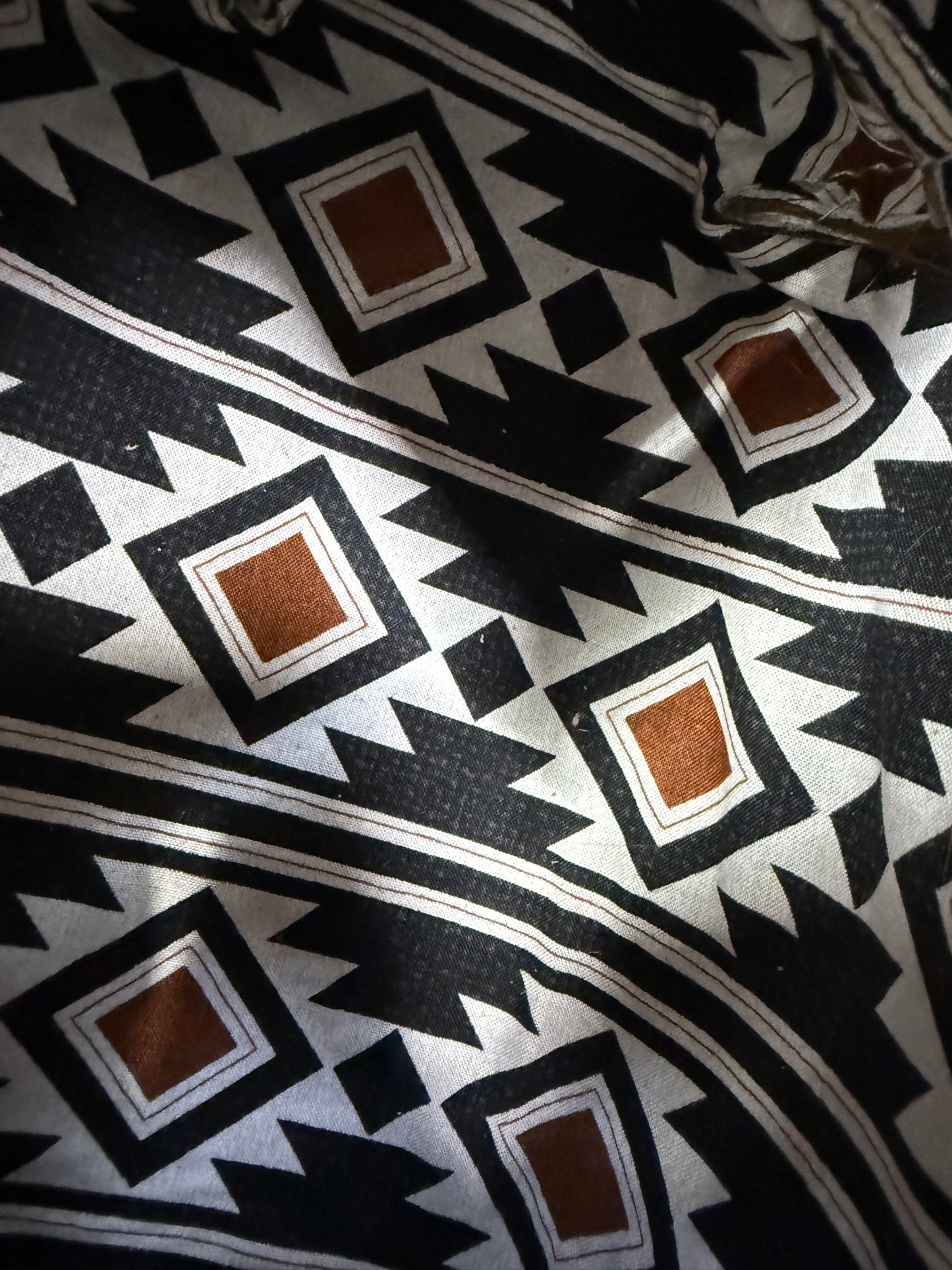 Brown hair on hide bag