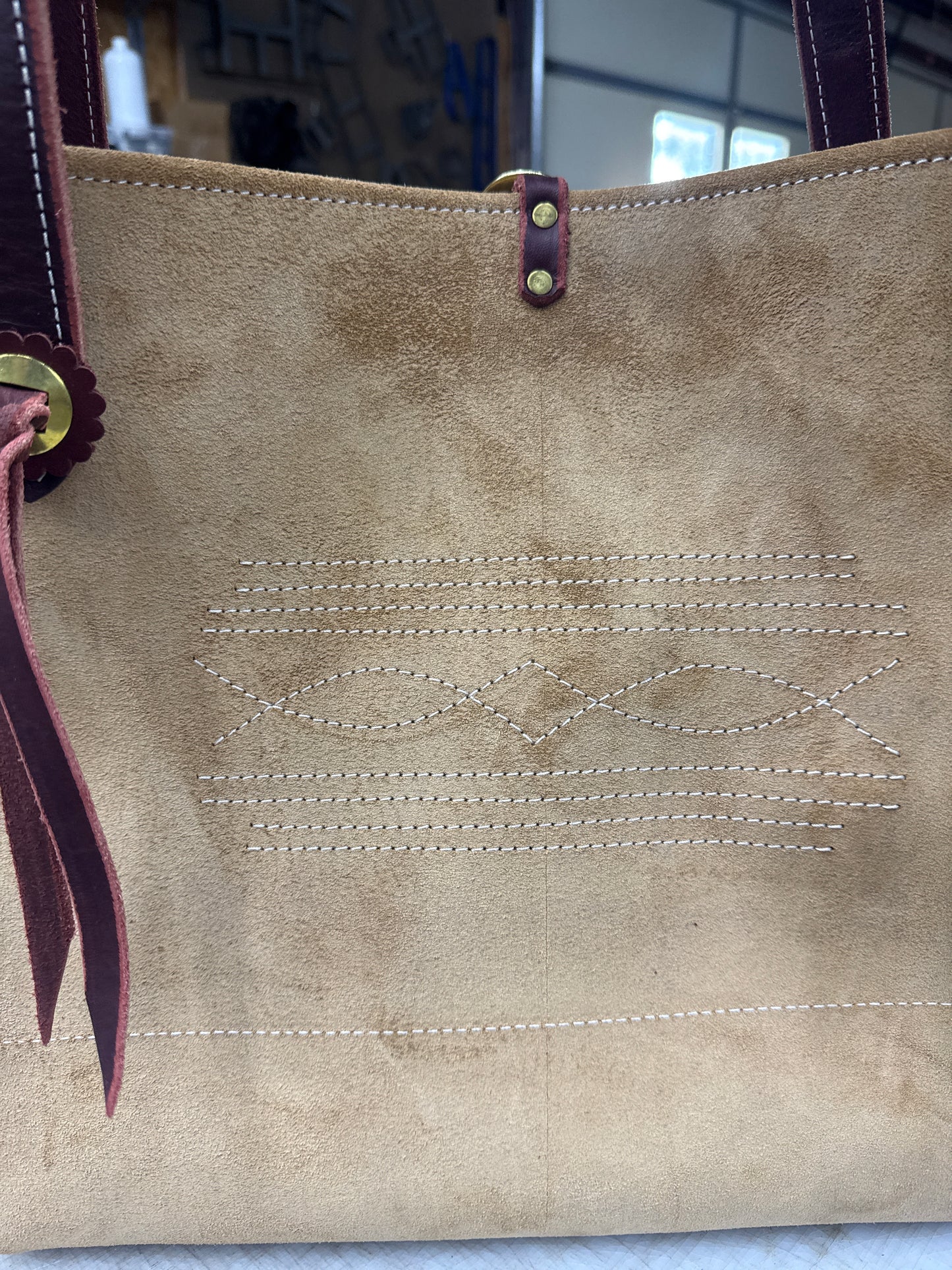 Tan ruff out tote with brass hardware