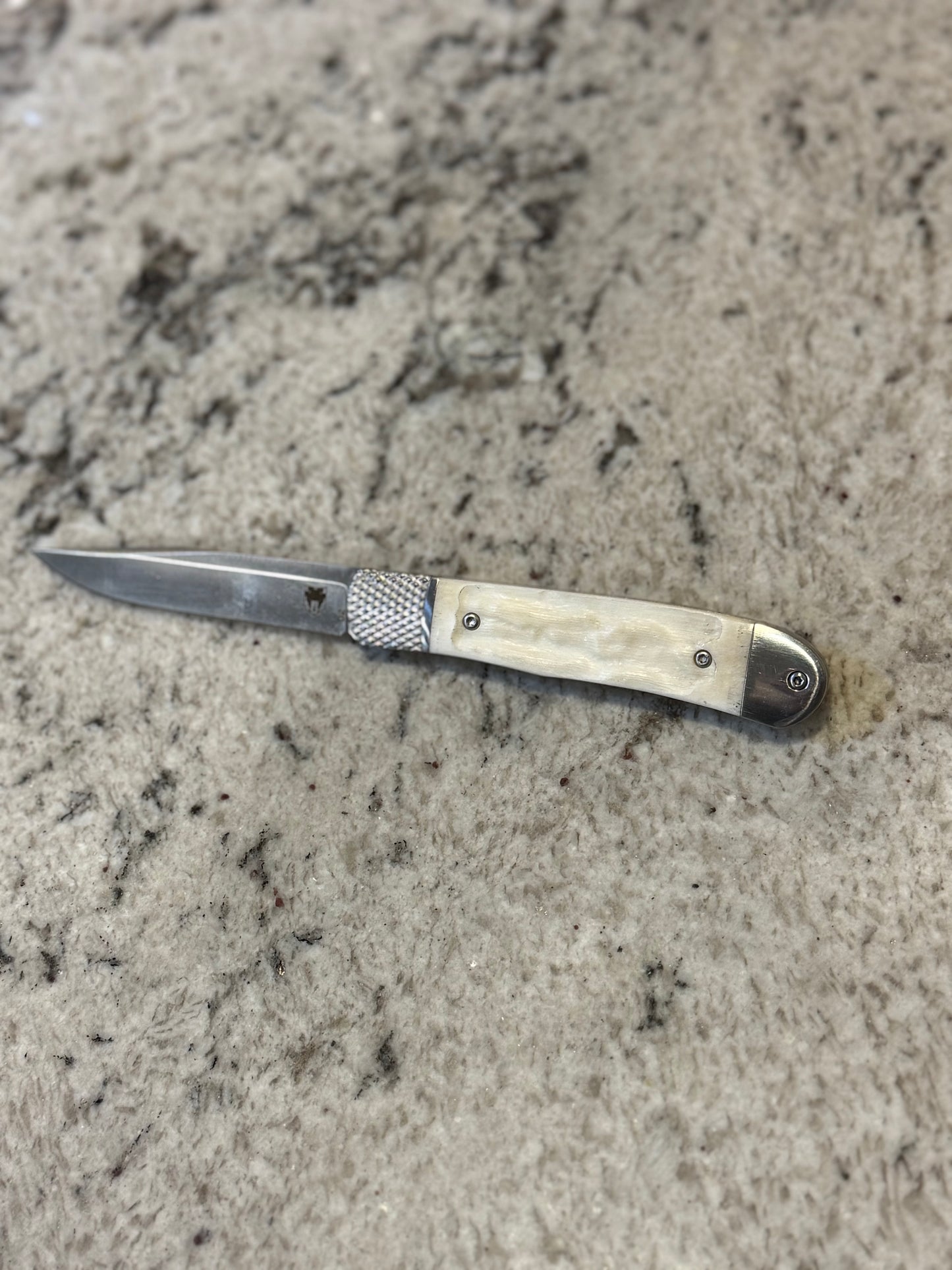 White Spring loaded Knife
