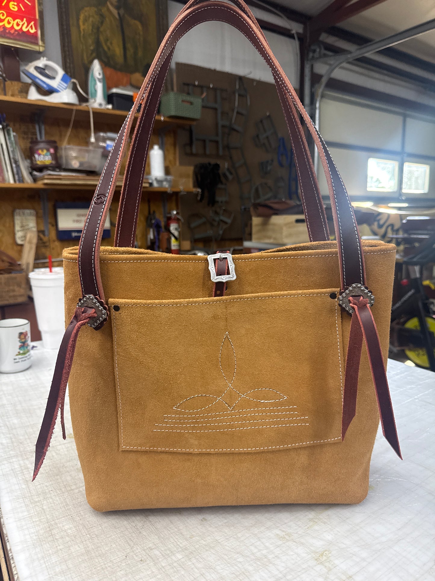 Tan ruff out tote with fancy hardware