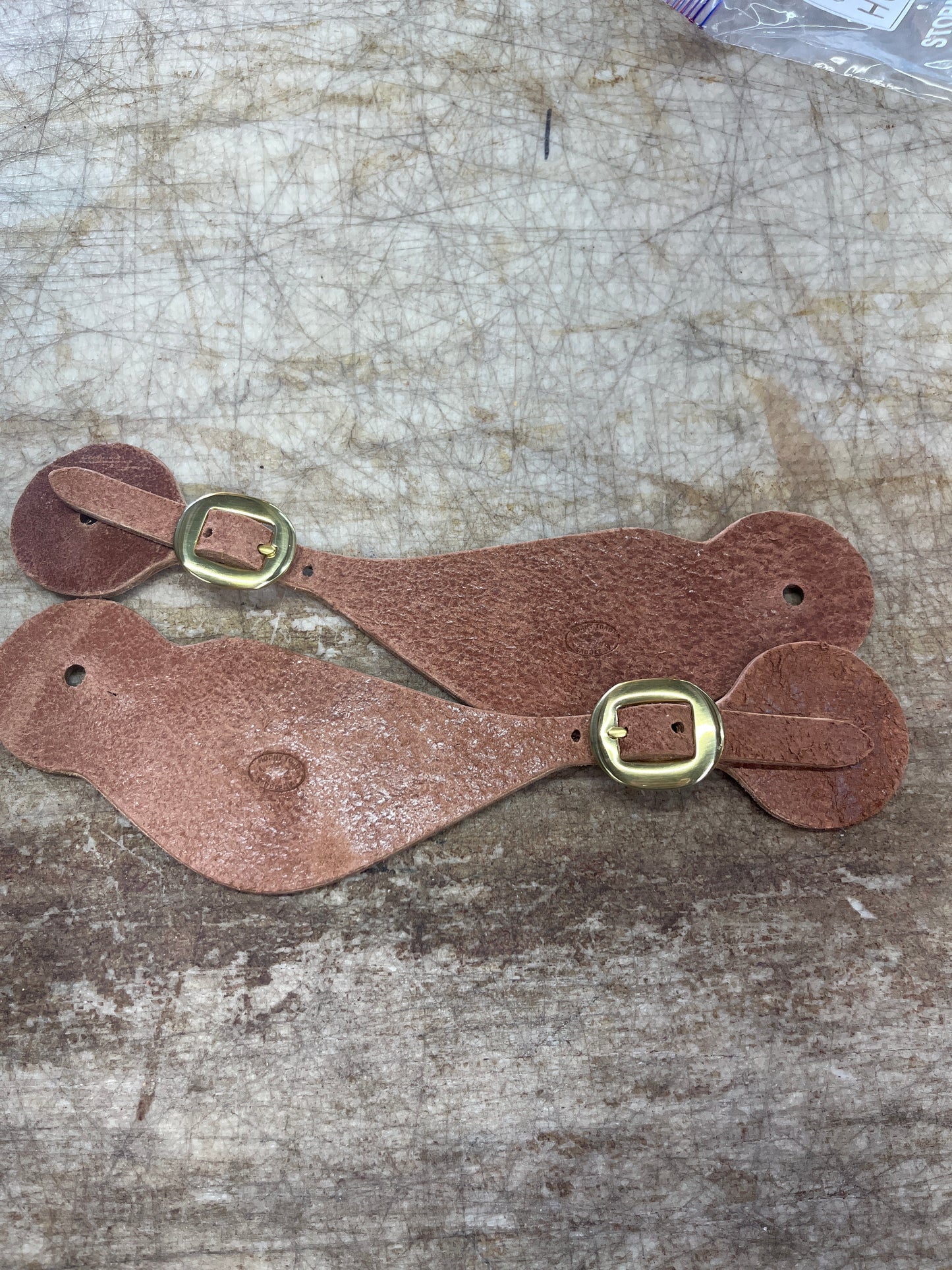 Large brass buckle spur straps