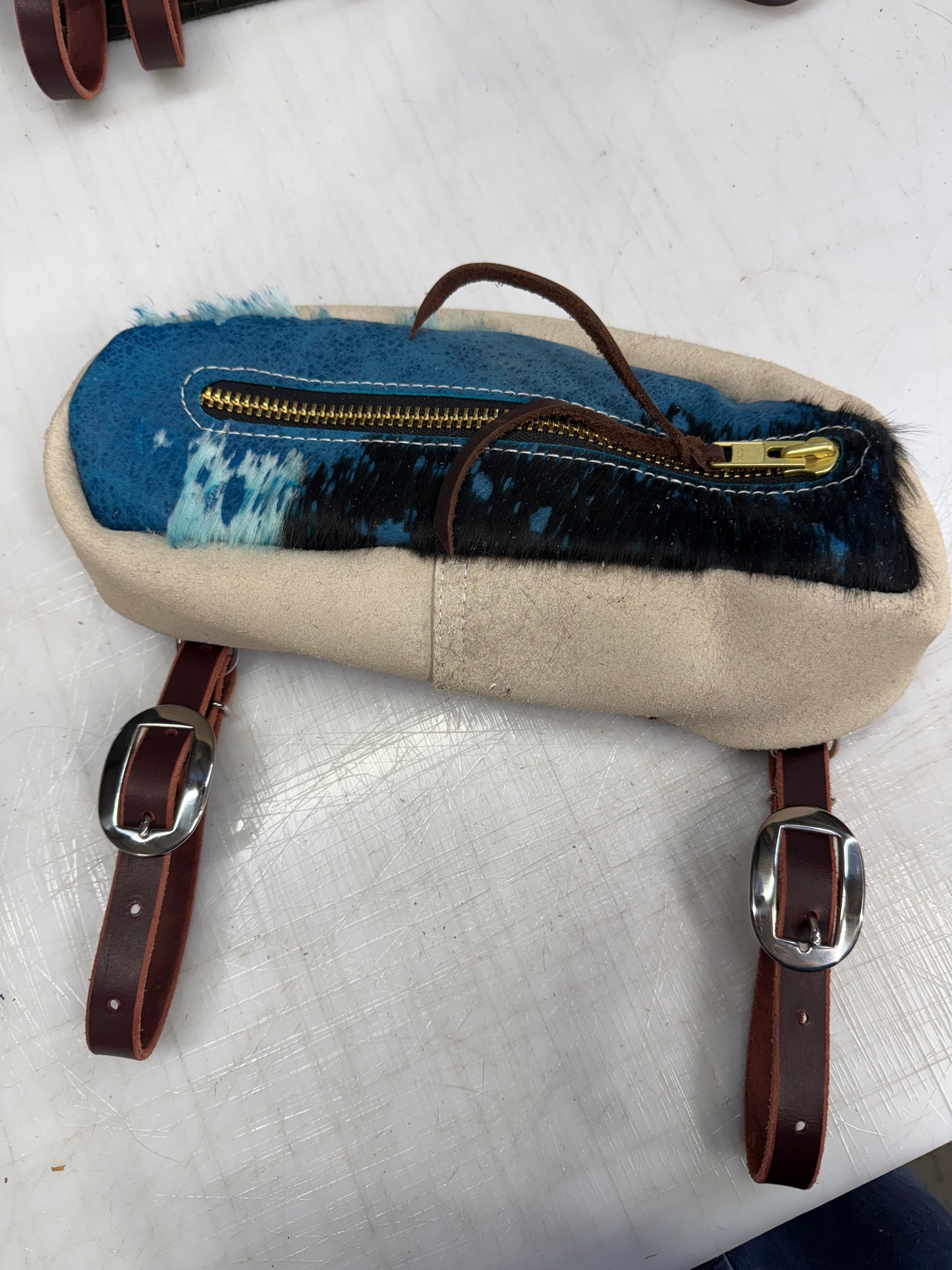 Blue hair on small cantle bag
