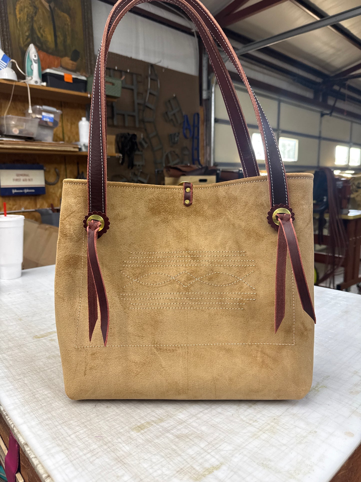 Tan ruff out tote with brass hardware