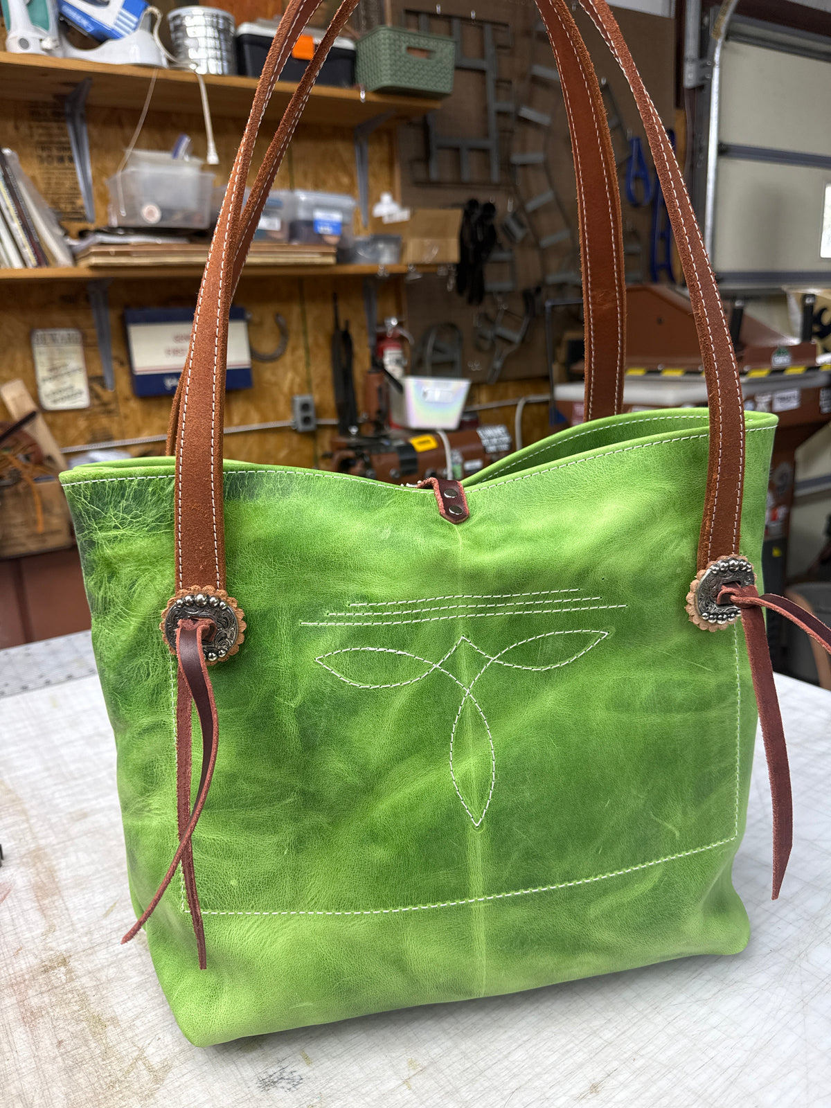 Green tote with fancy hardware