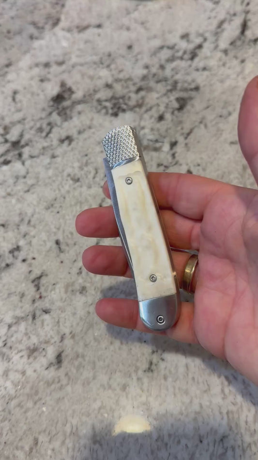 White Spring loaded Knife
