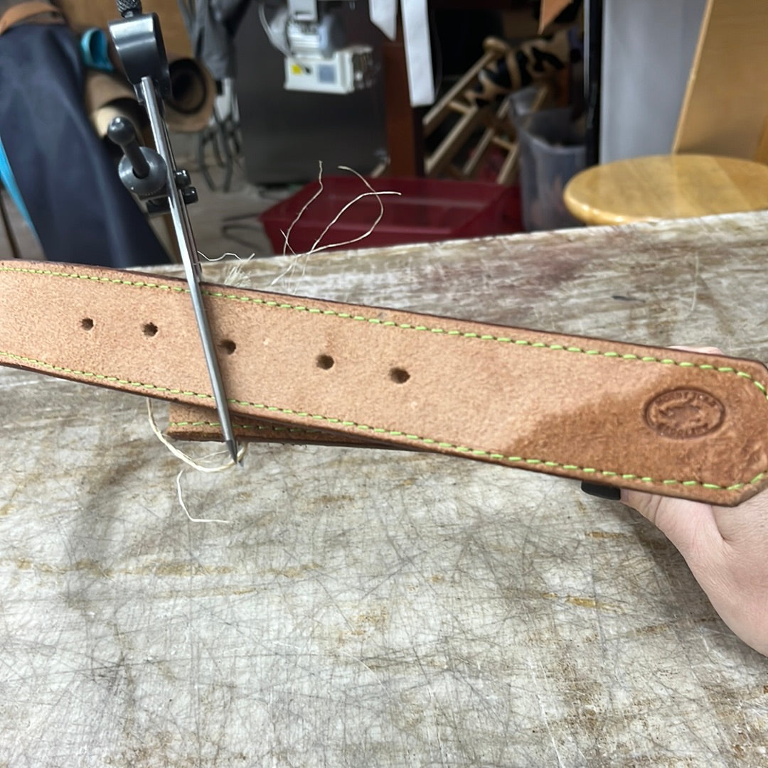 Green stitched belt